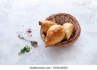 Delicious Samsa With Lamb And Spices Cooked In Tandoor On Stone Background. Uzbek And Central Asia Cuisine Concept