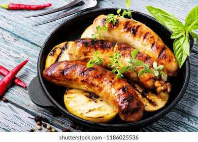 Delicious Sausages Grilled With Spices And Apples.Meat German Food