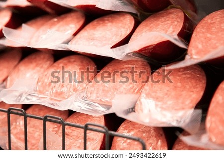 Delicious sausages on a supermarket fridge shelf