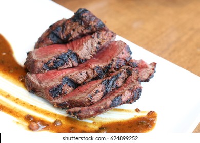 delicious seared steak tenderloin prepared rare in a red wine reduction sauce
