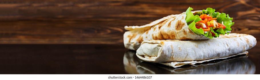 Delicious Shawarma Sandwich On Wooden Background. Banner.