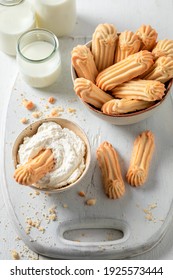 Delicious Shortbread Cookies In Old Bowl With Whipped Cream On White Table