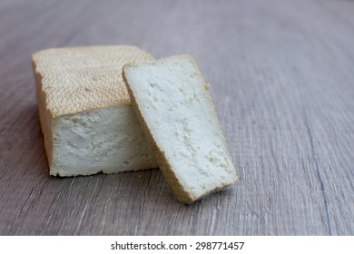 Delicious smoked tofu on wood table with slice tofu - Shutterstock ID 298771457
