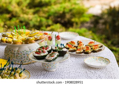 Delicious snacks on wedding reception table in luxury outdoor restaurant
