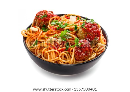 Delicious spaghetti pasta with meatballs and tomato sauce in a bowl. Traditional American Italian food isolated on white background.
