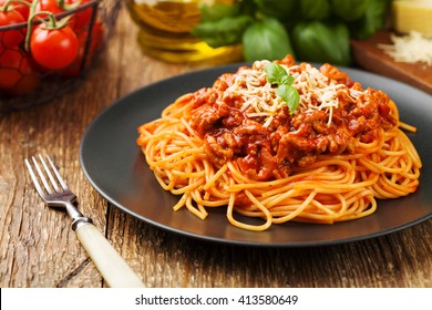Delicious spaghetti served on a black plate - Shutterstock ID 413580649