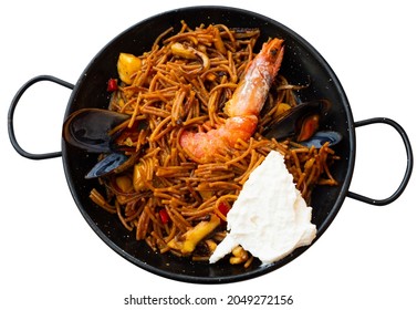 Delicious Spanish Dish Seafood Fideua, Noodle Paella Served With Aioli. Isolated Over White Background