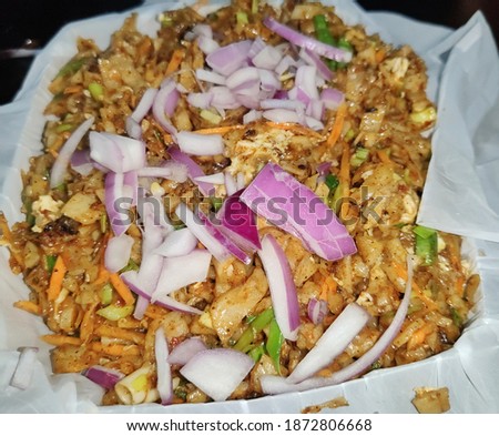 Delicious spicy Sri Lankan chicken kottu for dinner. Asian street food. Sri Lankan kottu dish