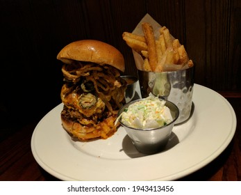 Delicious Stacked Burger With Fries And Coleslaw