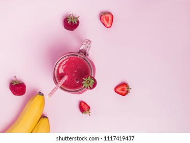 Delicious Strawberry And Banana Smoothie On The Pink Background, Top View