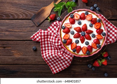 Delicious Strawberry Pie With Fresh Blueberry And Whipped Cream On Wooden Rustic Table, Cheesecake, Top View