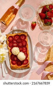 Delicious Strawberry Quick And Simple Tart Pie With Vanilla Ice Cream On The Pink Background. Summer Girls Brunch Party With Strawberry Pie And Champagne. Top View Sunny Light.