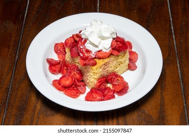 Delicious Strawberry Shortcake With A Dollop Of Whip Cream 