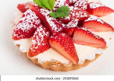 Delicious strawberry shortcake with whipped cream and fresh mint. Macro. Photo can be used as a whole background.