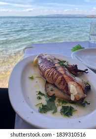 A Delicious Stuffed Calamari Preparation By The Ocean At Thessaloniki Beach.