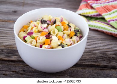 Delicious Summer Pasta Salad On Rustic Table With Feta And Red Onion