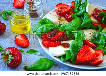Delicious summer salad with strawberries and mozzarella. Strawberry caprese salad.