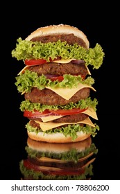 Delicious Super Size Hamburger Isolated On Black Background