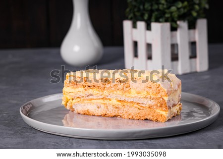 delicious sweet sans rival made with meringue layers filled with buttercream and cashew nuts