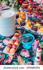 Delicious sweets on candy buffet. Lot of colorful desserts on table.
