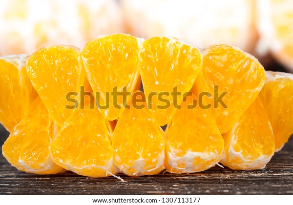 delicious tangerines,\
peeled orange peel lying on a wooden table, healthy citrus fruits\
with lots of vitamins