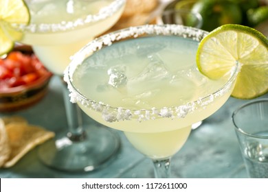 Delicious Tequila And Lime Margaritas On An Outdoor Table With Tortilla Chips And Pico De Gallo.