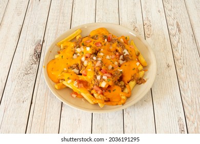 Delicious Tex Mex Potato Chips Recipe With Spicy Chili Stew, Pico De Gallo And Lots Of Melted Cheddar Cheese