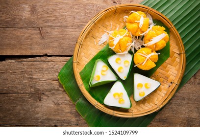 Delicious Thai Dessert , Thai jelly with coconut cream and Toddy palm cake on wooden Background.