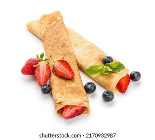 Delicious Thin Pancakes With Berries And Mint Leaves On White Background