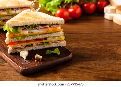 Delicious toast sandwich with ham, cheese, egg and vegetables. Front view.