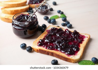 Delicious toast with sweet jam on wooden table - Powered by Shutterstock