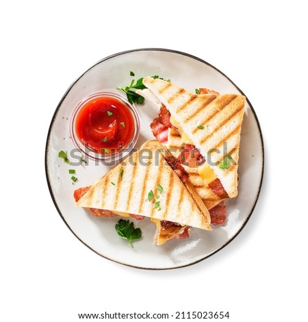 Delicious toasted sandwiches with cheddar cheese and bacon isolated on white background, top view