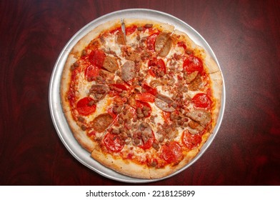 Delicious Tomato Sauce Cheese Covered Hot And Tasty Meat Lovers Pizza Pie 