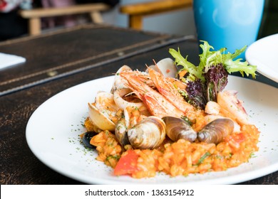 Delicious Tomato Seafood Stew. There Are Shrimp, Clams, Tomatoes And Seafood On It.
