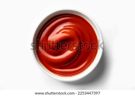 Delicious top view ketchup in white bowl isolated on white background. Portion of tomato sauce with clipping path. One of the collection of various sauces