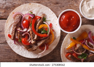 Delicious Tortillas Stuffed With Meat And Vegetables Close-up. Horizontal View From Above
