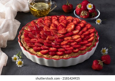 Delicious traditional homemade strawberry pie Crostata on gray background