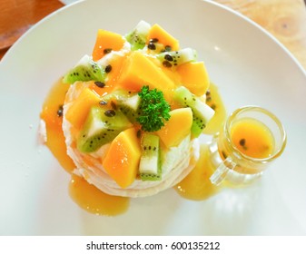 Delicious Tropical Pavlova With Kiwi And Mango