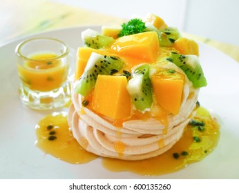 Delicious Tropical Pavlova With Kiwi And Mango