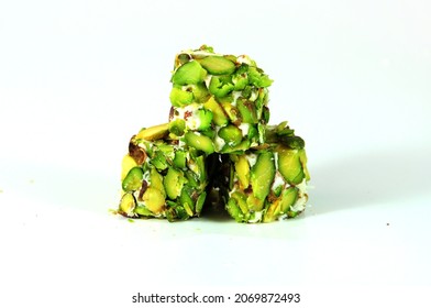 Delicious Turkish Delight with pistachios on white background.