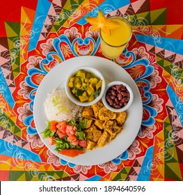 Delicious typical Costa Rican lunch on a colorful table of the Costa Rican cart