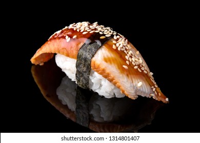 Delicious Unagi Eel Nigiri Sushi (Eel Sushi) on black background. Traditional Japanese cuisine