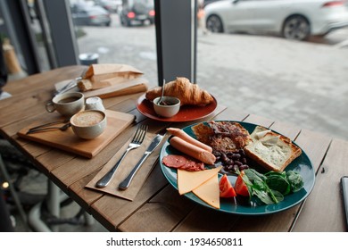 Delicious Vegan Breakfast Scrumbbled Eggs Of Tofu Cheese, Soyabean Sausage And Beans