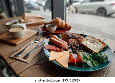 Delicious Vegan Breakfast Scrumbbled Eggs Of Tofu Cheese, Soyabean Sausage And Beans