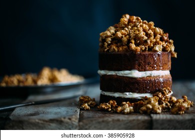 Delicious vegan super caramel cake with pop corn on beautiful wooden stands in vintage interior
