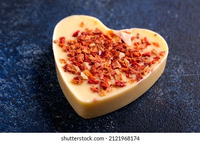 Delicious White Chocolate Heart On Blue Rustic Table.