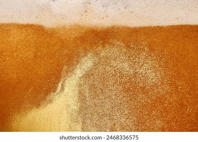 Delicious-looking beer poured into glass. Beer pale golden color and has thick, white head of foam. Textured photo. Abstract background. Concept of refreshing alcohol drink, Oktoberfest, summer, party