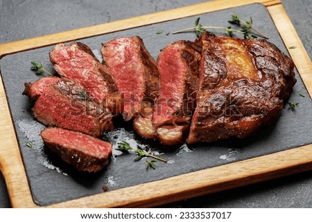 Deliciously juicy sliced beef ribeye steak, perfectly cooked and ready to be savored