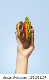 Delicous veggie burger in a person hand