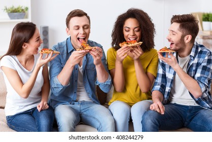 Delighted Friends Eating Pizza